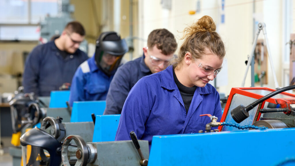 Photo of a group of students working in an engineering workshop