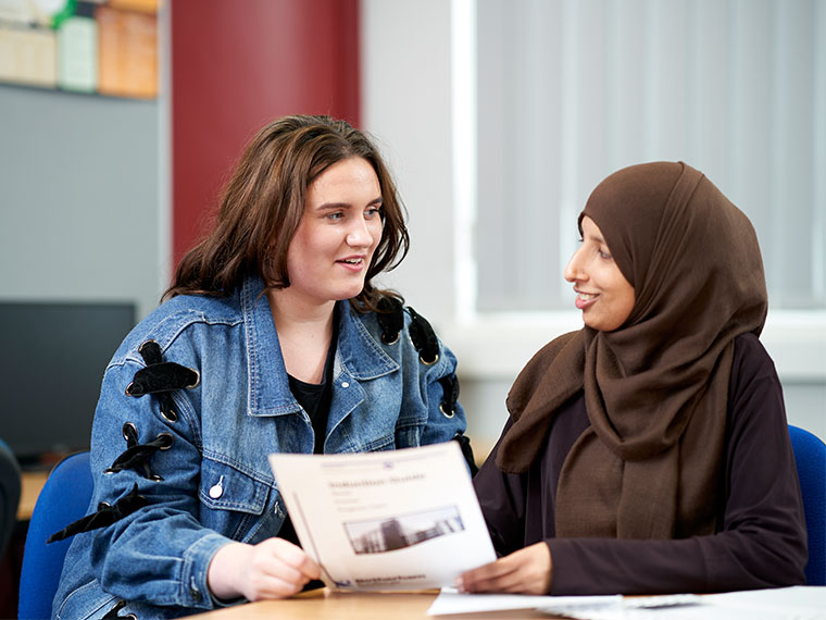A counselling student with a client