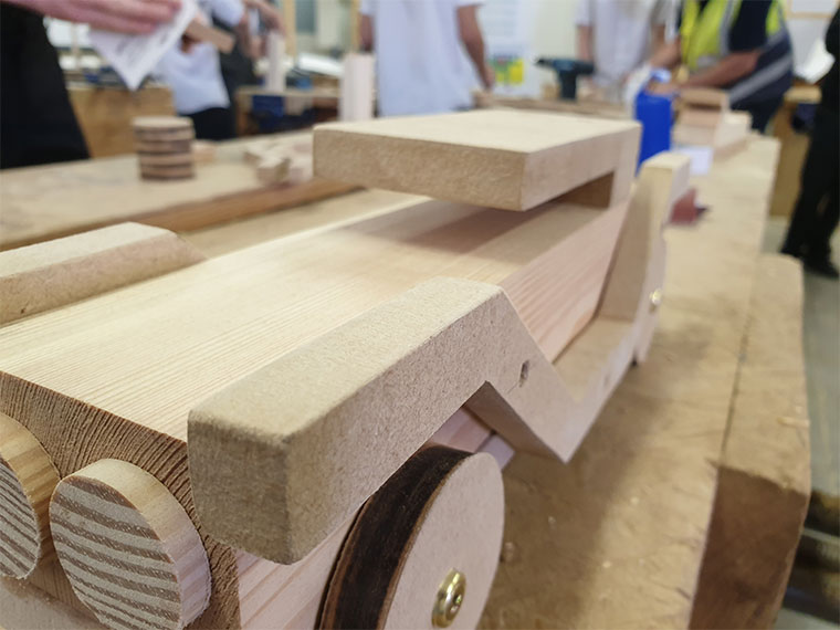 A wooden toy car made by a Netherwood Academy student.