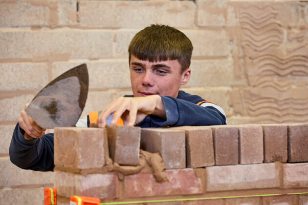 A bricklaying student