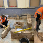 Construction students taking part in the brick pressure test competitions
