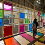 A corridor with coloured windows at Dearne Valley College