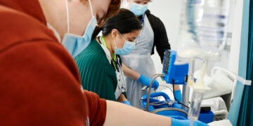 Students in the health suite wearing PPE
