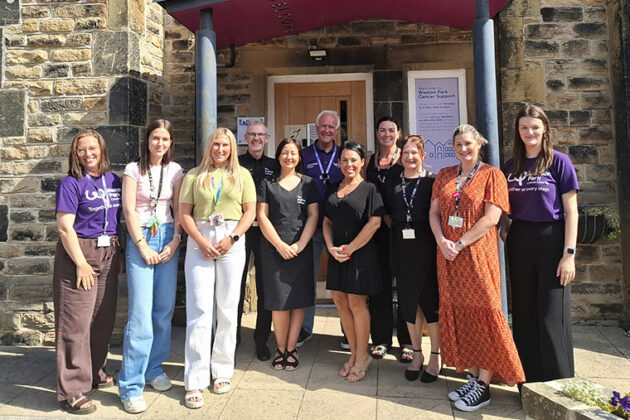 A group of people celebrating the partnership between Rotherham College, North Notts College, Dearne Valley College and Weston Park Cancer Charity